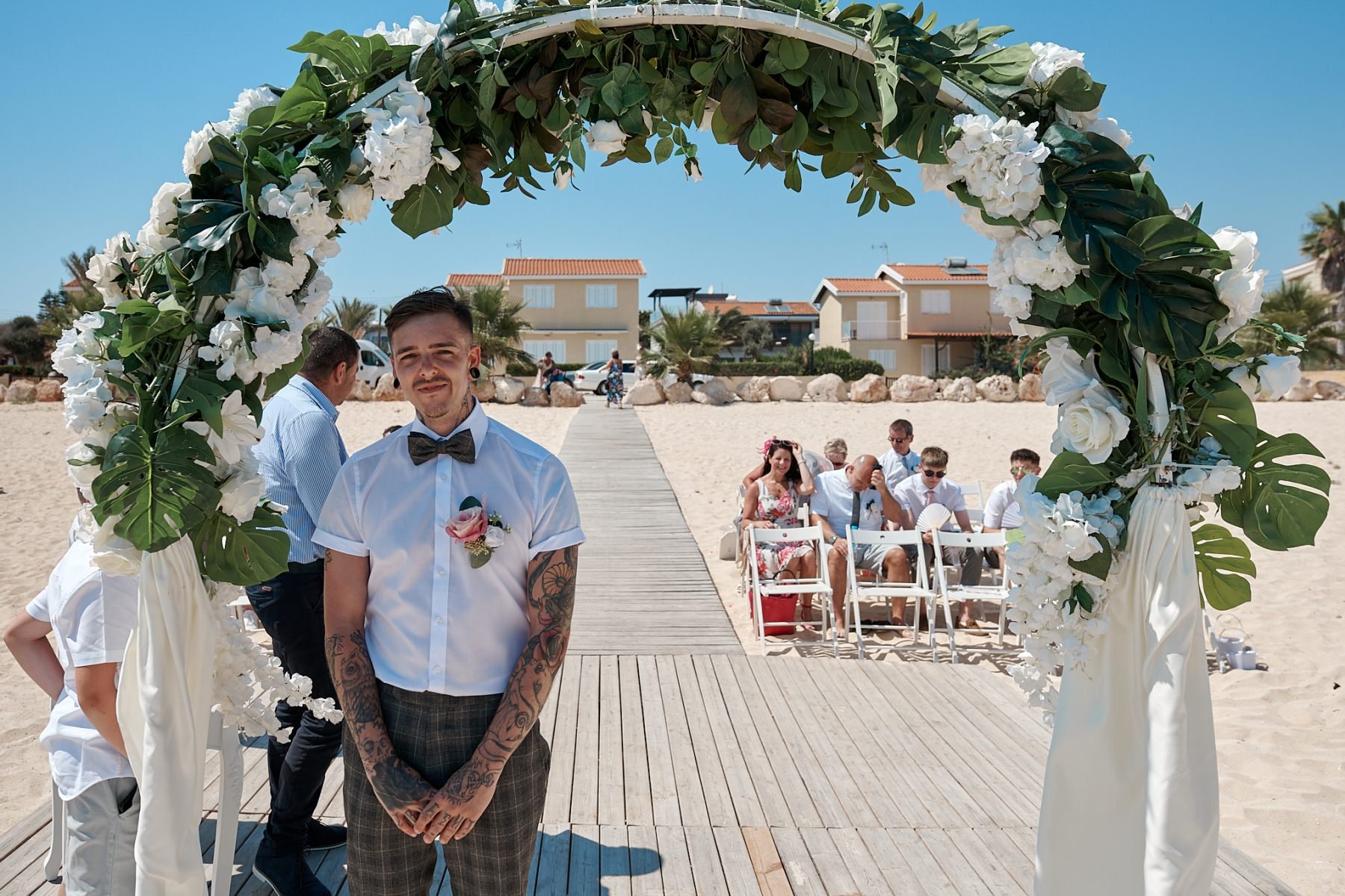 The elegant bohemian wedding of Abbie & Lee.  Getting ready shots at Napa suites in, Ayia Napa, and Villa Cynthia in Protaras.  The wedding  ceremony held at Sirens beach in Ayia Thekla and the wedding reception at.  Polyxenia Isaak in Protaras.  We had an on loaction trip out to Cape Greco and Blood Brothers tattoo parlour in Ayia Napa..  Wedding photography in Cyprus by Richard King  http://www.thecyprusweddingphotographer.com